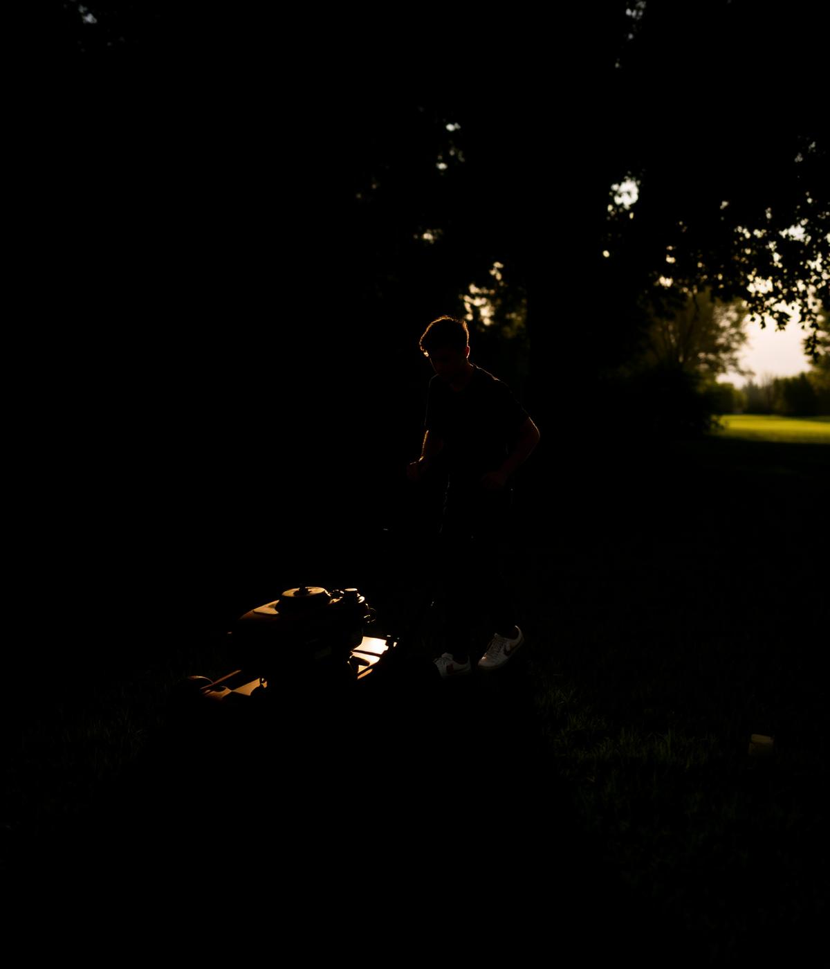 East End Cuts mowing a lawn at sunset